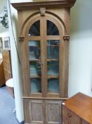 A PAIR OF MID GEORGIAN STYLE BESPOKE PINE FRONTED BARREL BACK NICHE CABINETS WITH GLAZED DOORS