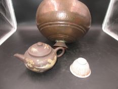 A YIXING TEA POT AND COVER PAINTED IN BEIGE SLIP WITH ISLAND SCENES, SIX CHARACTER MARK, A PORCELAIN