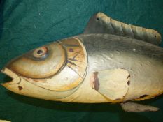 A VINTAGE PAINTED TOLEWARE FISHMONGERS SIGN / SYMBOL IN THE FORM OF A FISH. L.94cms.