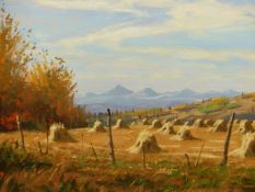 MANNIE GONSALVES. (1926-2012) ARR. CORN STOOKS, TURNER VALLEY, ALBERTA, OIL ON BOARD. 40 x 50cms.