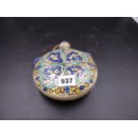 A POTTERY MOON FLASK, POSSIBLY TURKISH, PAINTED ON ONE SIDE WITH FOUR AUBERGINE OUTLINED BLUE LEAVES