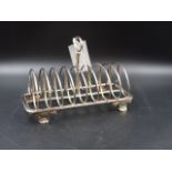 A 19th C. SILVER ELDER & CO TOAST RACK, DATED 1831, LENGTH 20cms, WEIGHT 437grms.
