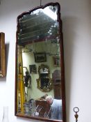 A LARGE 18th.C.AND LATER WALNUT FRAME BEVELLED EDGE PIER MIRROR WITH SCROLLED TOP. W.60 x H.121cms.