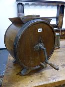 AN ANTIQUE OAK AND IRON BOUND BUTTER CHURN. Dia.40cms.