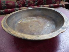 AN ANTIQUE TURNED WOOD FRUIT BOWL. Dia.43cms.