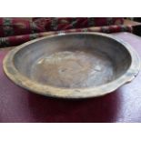 AN ANTIQUE TURNED WOOD FRUIT BOWL. Dia.43cms.