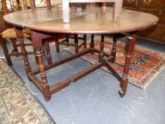 AN 18th.C.OAK COTTAGE GATELEG TABLE WITH TURNED SUPPORTS. W.124cms.