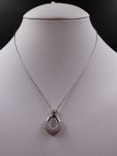 AN 18ct WHITE GOLD PAVE SET ARTICULATED DIAMOND SET DROP PENDANT. MEASURMENTS 2.3cms X 1.8cms,