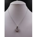 AN 18ct WHITE GOLD PAVE SET ARTICULATED DIAMOND SET DROP PENDANT. MEASURMENTS 2.3cms X 1.8cms,