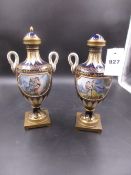 A PAIR OF 19th.C.SEVRES STYLE TWO HANDLED VASES AND COVERS, THE WHITE BEAD FRAMED RESERVES ON ONE