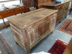 AN EARLY 18th.C.OAK COFFER WITH PLANK TOP OVER FOUR RAISED PANEL FRONT ON STILE SUPPORTS AND OLD BUT