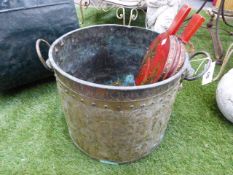 A 19th.C.DUTCH STYLE LARGE BRASS COAL BUCKET WITH EMBOSSED ARMORIAL AND LION MASK HANDLES TOGETHER