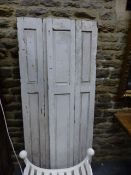 A PAIR OF ANTIQUE PINE PANEL FOLDING WINDOW SHUTTERS. OVERALL W.100 x H.178cms.