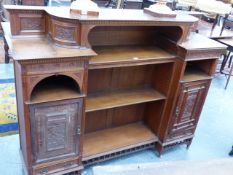 A LATE VICTORIAN AESTHETIC MOVEMENT SIDE CABINET / BOOKCASE WITH CARVED DECORATION. 160 x 41 x H.