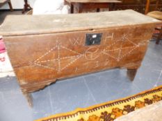 AN 18th.C.OAK PLANK COFFER WITH CARVED FRONT, DATED 1730. 112 x 65 x 39cms.