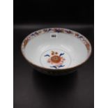 A CHINESE EXPORT IMARI BOWL AND COVER PAINTED WITH CHRYSANTHEMUMS AND OTHER FLOWERS. Dia.22cms.