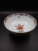 A CHINESE EXPORT IMARI BOWL AND COVER PAINTED WITH CHRYSANTHEMUMS AND OTHER FLOWERS. Dia.22cms.