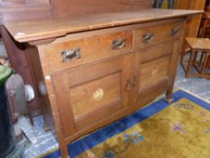 AN EARLY 20th.C.ARTS AND CRAFTS OAK SIDE CABINET WITH TWO DRAWERS OVER INLAID PANEL DOORS. 152 x