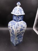 A CHINESE BLUE AND WHITE VASE AND COVER, THE BALUSTER SHAPE OF RECTANGULAR SECTION, THE SIDES