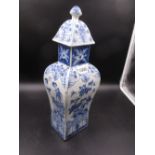 A CHINESE BLUE AND WHITE VASE AND COVER, THE BALUSTER SHAPE OF RECTANGULAR SECTION, THE SIDES