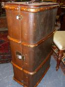 A VINTAGE WOOD BOUND CANVAS CABIN TRUNK WITH BRASS FITTINGS.