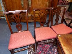 A SET OF FIVE EARLY 19th.C.OAK DINING CHAIRS WITH PIERCED BACK AND DROP IN SEATPADS. A FURTHER