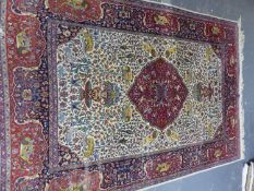 AN ORIENTAL RUG OF PERSIAN ANIMAL DESIGN. 276 x 186cms.