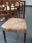 AN ARTS AND CRAFTS STYLE LATTICE BACK SIDE CHAIR ON SQUARE TAPERED LEGS.