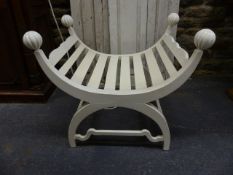 A PAIR OF UNUSUAL CARVED AND PAINTED CONSERVATORY / WINDOW SEATS OF U-SHAPE WITH RIBBED BALL