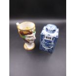 A DELFT BLUE AND WHITE SCREW LIDDED TEA CADDY, THE SQUARE SECTIONED SIDES WITH ALTERNATING OVALS