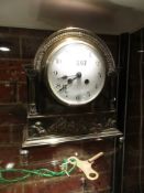 AN EARLY 20th.C. SILVER PLATE CASED FRENCH MANTLE CLOCK, THE 8-DAY MOVEMENT STRIKING ON A COILED ROD