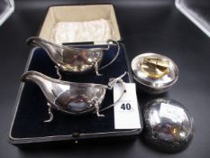 A CASED PAIR OF SAUCE BOATS AND A RONSON TABLE LIGHTER WITH GILDED INNER COVER. THE DECO SAUCE BOATS