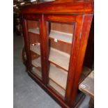 A VICTORIAN MAHOGANY SMALL BOOKCASE WITH GLAZED DOORS. 91 x 104cms TOGETHER WITH AN ORIENTAL