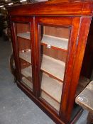 A VICTORIAN MAHOGANY SMALL BOOKCASE WITH GLAZED DOORS. 91 x 104cms TOGETHER WITH AN ORIENTAL