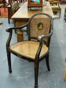 AN EARLY 20th.C.CHINOISERIE DECORATED CANE BACK BERGERE ARMCHAIR TOGETHER WITH A SIMILARLY DECORATED