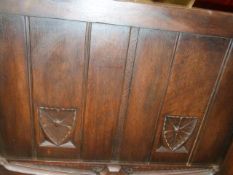 A PAIR OF GOTHIC REVIVAL PANELLED OAK SINGLE BED FRAMES. (2)