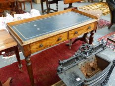 A VICTORIAN MAHOGANY WRITING TABLE WITH TOOLED LEATHER INSERT TOP OVER TWO DRAWERS ON TURNED LEGS.