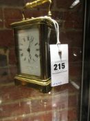 A FRENCH CARRIAGE CLOCK RETAILED BY J.W. BENSON, THE STRIKE/REPEAT ON A COILED ROD. H. 11.5cms.