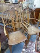 THREE BEECH AND ELM WHEELBACK WINDSOR ARMCHAIRS WITH CRINOLINE STRETCHERS. (3)