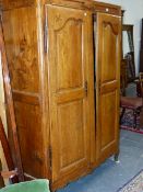 A FRENCH PROVINCIAL CARVED AND INLAID WALNUT AND FRUITWOOD ARMOIRE WITH TWIN PANEL DOORS. H.192 x