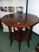 A LATE 19th/20th.C. OCTAGONAL CENTRE TABLE ON TURNED COLUMN SUPPORTS WITH UNDER TIER IN THE ARTS AND