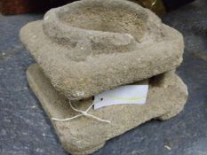 AN EARLY WEATHERED CARVED STONE MORTAR, POSSIBLY EASTERN. W.24 x H.18cms.