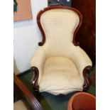 A VICTORIAN MAHOGANY SHOW FRAME ARMCHAIR ON SCROLL SUPPORTS.