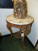 A VINTAGE CAST IRON MARBLE TOP PUB TABLE ON FIGURAL SUPPORTS, CARDIFF MAKER. Dia.50 x H.74cms.