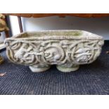 A PAIR OF GARDEN PLANTERS WITH CLASSICAL FIGURE AND VINE DECORATION, EACH 56 x 32cms.