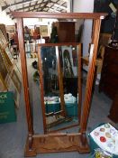 AN OAK FRAMED ART DECO STYLE CHEVAL MIRROR ON PLATFORM BASE. W.91 x H.175cms.