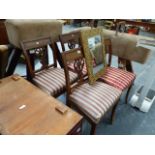 A SET OF FOUR CONTINENTAL OAK DINING CHAIRS.