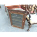 A GLAZED CORNER CABINET.