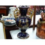 A PAIR OF LARGE GILT DECORATED VASES.