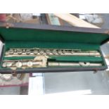 A COUTURE WHITE METAL FLUTE.